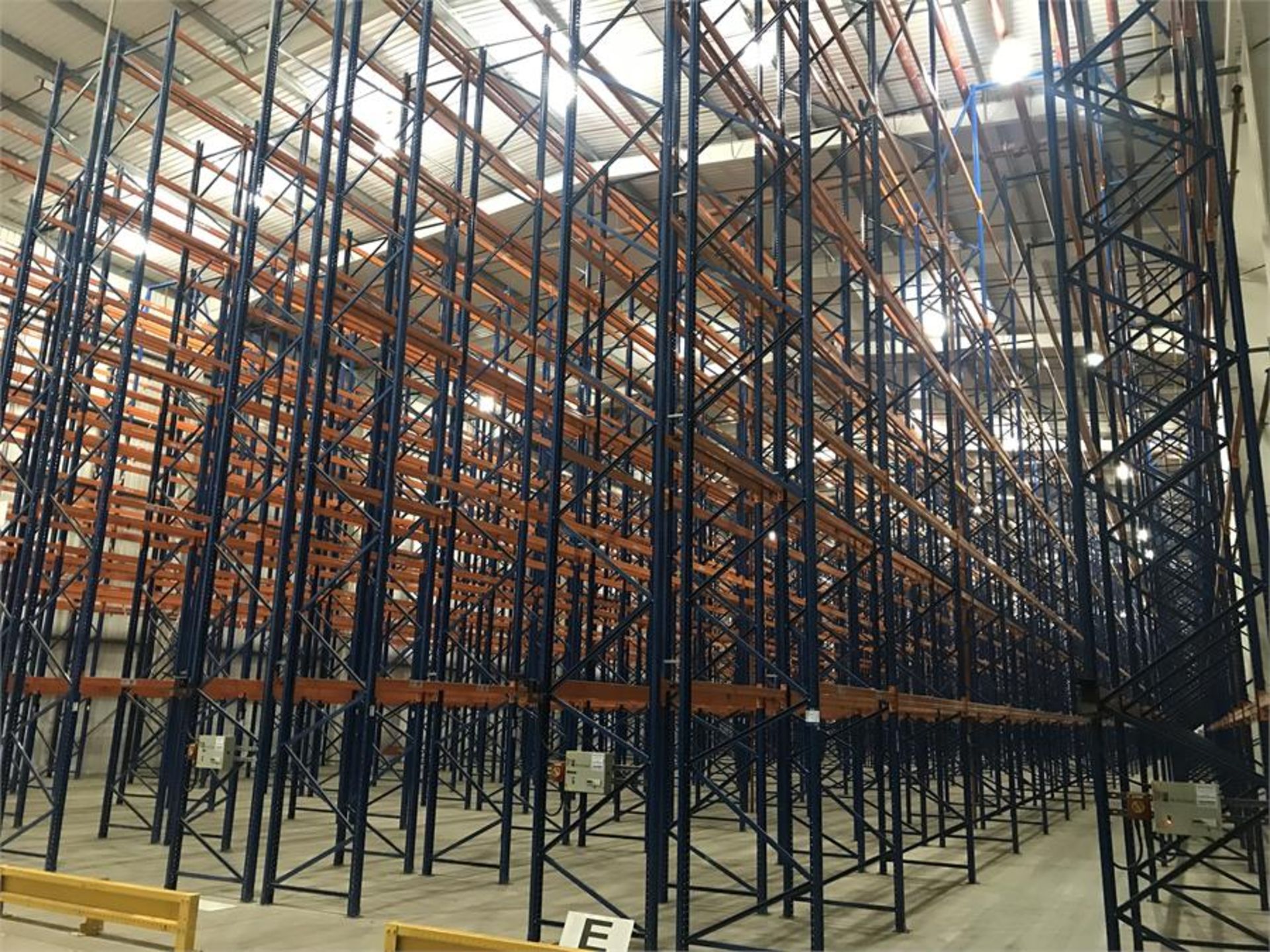 High bay racking system comprising 8500 pallet spaces over 14 runs:- 1 x 54 (11000mm x 1100m) end