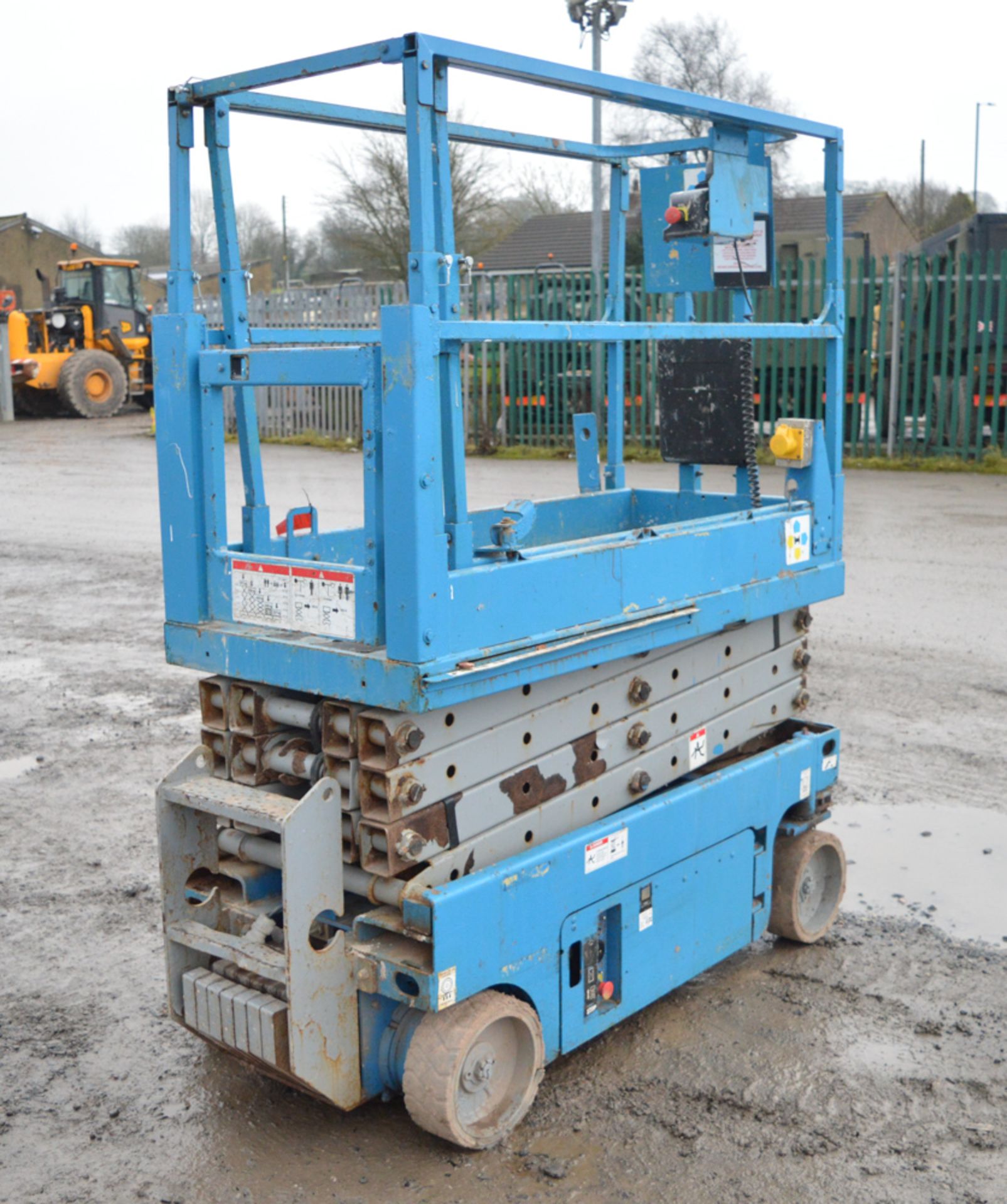 Genie 1930/32 19 ft battery electric scissor access platform Year: 2006 S/N: 81548 Recorded Hours: