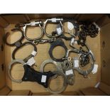 A collection of eight pairs of Police Handcuffs/restraints dating from the early 20th Century to