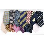 A collection of assorted men's silk ties, mostly woven,