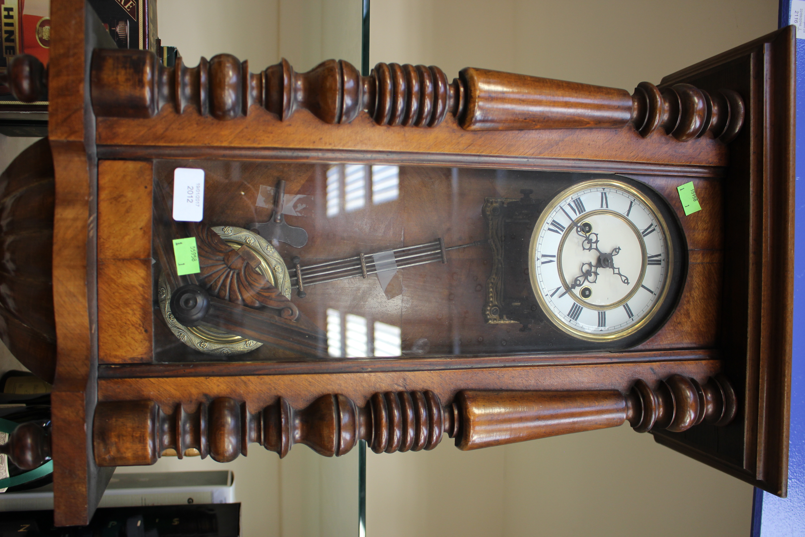 A late 19th Century German mahogany wall clock with Roman numerals