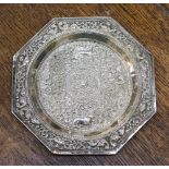 An Eastern white metal octagonal dish, embossed with animals amongst scrolled foliage, 145 grams/4.