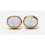 A pair of synthetic opal ear studs in yellow gold,