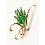 A Jadeite set 14ct gold brooch, the swirl design brooch set with cabachon cut Jadeite spray,