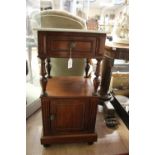 A late 19th Century mahogany marble topped pot cupboard, having a single drawer,