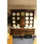 A George II style oak dresser and rack,