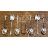 A set of six Victorian silver coffee spoons and sugar tongs in the Rococo revival style,