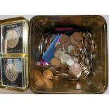 A tin of assorted coins