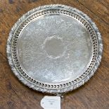 A Victorian silver tray by James Dixon & Sons of circular form, central scroll and leaf pattern,