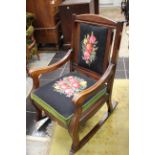 A late Victorian mahogany rocking chair