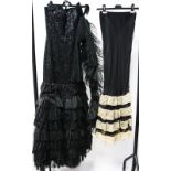 A black heavily sequinned spotted net evening dress with two stoles sequinned and one plain net by