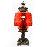 A large Cranberry glass table lamp,