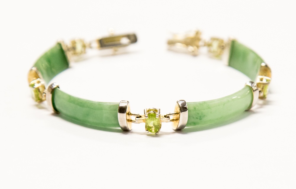 A silver gilt and jade bracelet, 14.