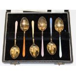 A set of six George VI silver and enamel teaspoons, multicoloured enamels, gilt bowls,