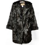 A dark brown ladies knee length Squirrel coat,