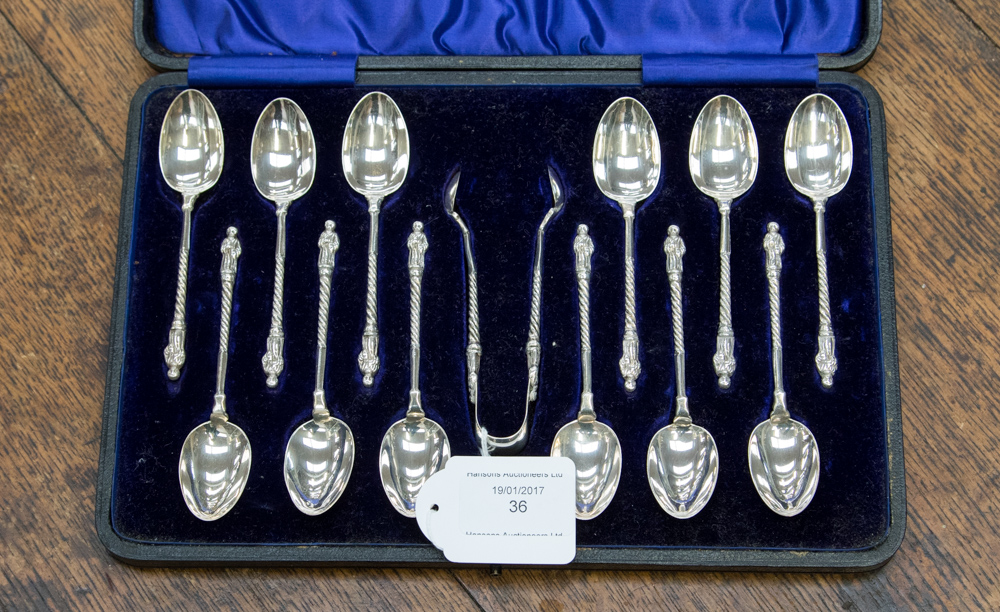 A boxed thirteen piece silver apostle tea spoon set, maker Stokes & Ireland Ltd,