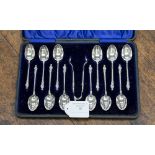 A boxed thirteen piece silver apostle tea spoon set, maker Stokes & Ireland Ltd,