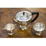 An Art Deco silver three-piece tea set, comprising teapot, milk and sugar,