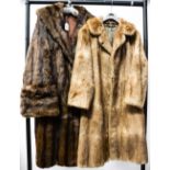One shaded Musquash fur full length coat with turned back cuffs and cowl collar,
