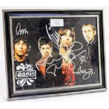 Oasis full colour photograph framed autographed in silver sharpie