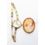 A ladies circa 1920s 9ct gold wrist watch, with gold plated strap,