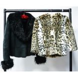 A black suede short jacket with a fur lining and a black Fox collar by Italian designer Fiorelli