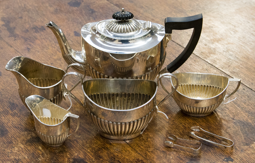 A silver tea service comprising teapot, sugar bowl and milk jug by Emile Viner,