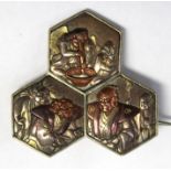 A Samurai brooch Meiji period, pre WWI, raised depictions of Samurai Life,