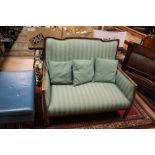 An early 20th Century two seater settee,