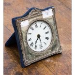 A modern silver mantle clock,