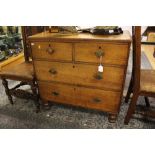 A mid 20th Century oak chest of drawers, fitted with two short and two long graduated drawers,