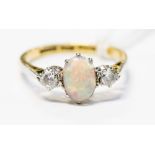 An 18ct gold, opal and diamond three stone ring, 2.