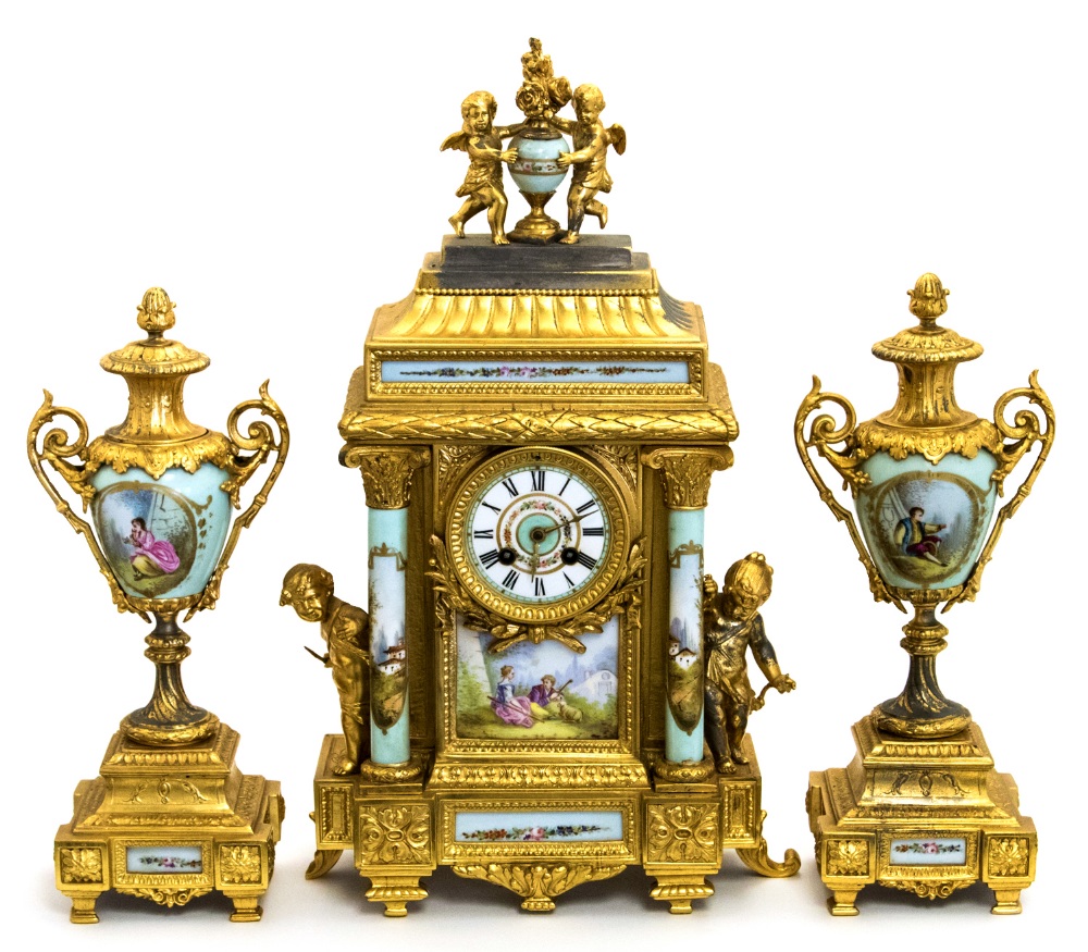 A French gilt metal and porcelain clock garniture,
