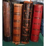 Four leather bound and embossed Victorian photograph albums including sepier photographs,