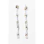 A pair of diamond chip set 18ct white gold drop earrings, gross weight approximately 3.