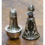 An Art Nouveau white metal overlaid scent bottle; together with a silver sugar shaker,