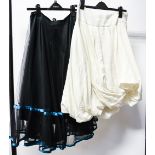 A stiff net black skirt,