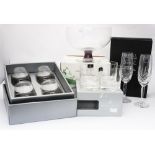 Four boxed glassware items including Dartington Aura and Royal Doulton,