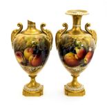 A pair of Royal Worcester fruit painted vases by Ricketts, 1924, pedestal twin handled urn form,