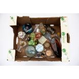 A box of perfume bottles and paper weights,