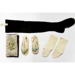 A pair of cased hand embroidered Chinese child's shoes with a pair of socks,