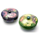 Two Moorcroft powder boxes and covers, lily and fuchsia, late 20th century, impressed marks,