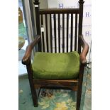 An Arts and Crafts open armchair, the uprights with ball finials, slatted back and slatted seat,