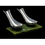 An Art Deco style silver plated and onyx effect double pipe rest, by Seba,