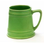 William Moorcroft, a matte glazed green mug, banded conical form, circa 1915, impressed marks,
