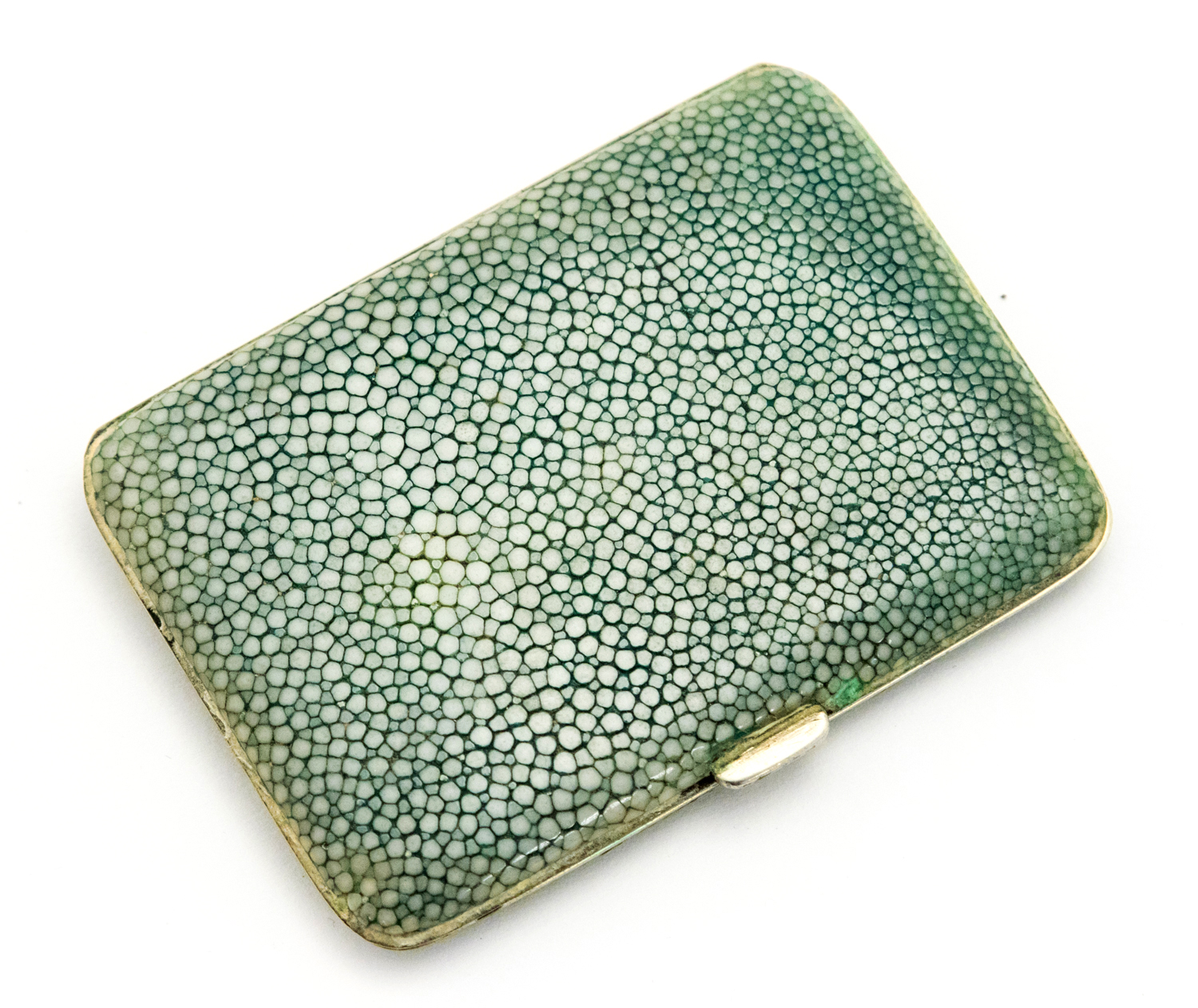 An Art Deco shagreen cigarette case, white metal with gilt interior, marked for PH Vogel, 9cm long,