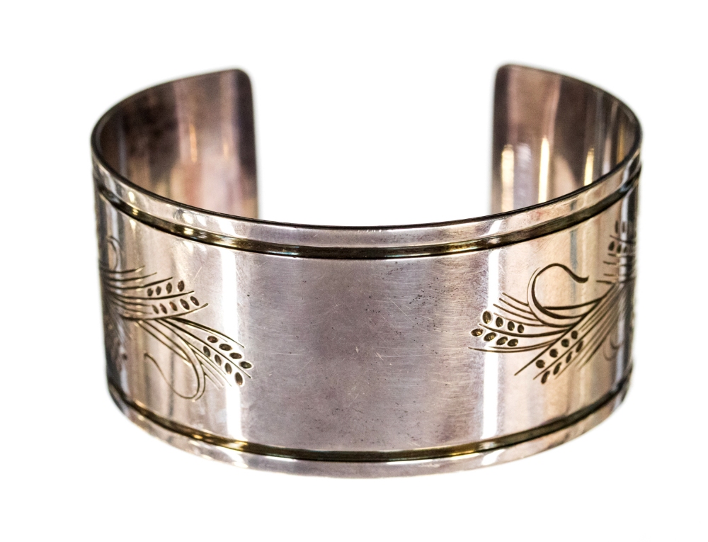 Georg Jensen, a Danish silver bangle or cuff, engraved with a stylised wheat design, pattern 85 B,