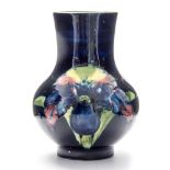 A Moorcroft Orchid vase, baluster form, blue ground, impressed marks,