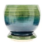 Walter Moorcroft for Moorcroft, a polychrome jardiniere, ovoid form with fluted body,