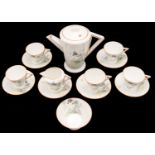 Eric Slater for Shelley, an Art Deco Eve coffee set, stylised flower and butterfly design,